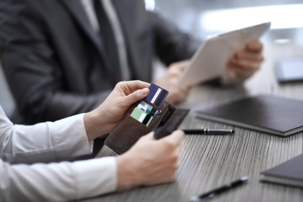 close up of buyer pulling out a card from wallet