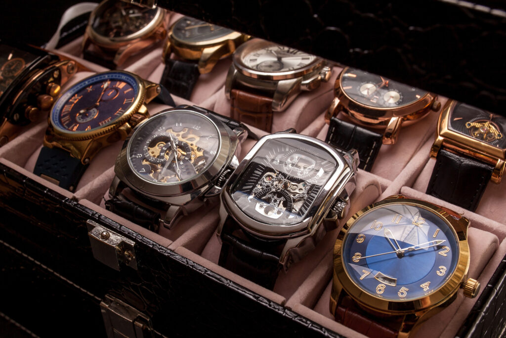 collection of mens watches in leather display case